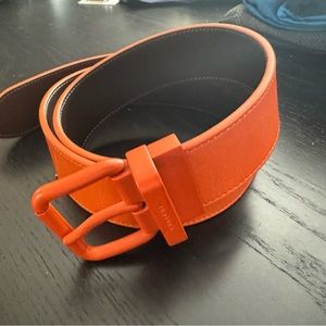 Men’s Coach leather belt. Reversible orange and brown. 32-36 waist.